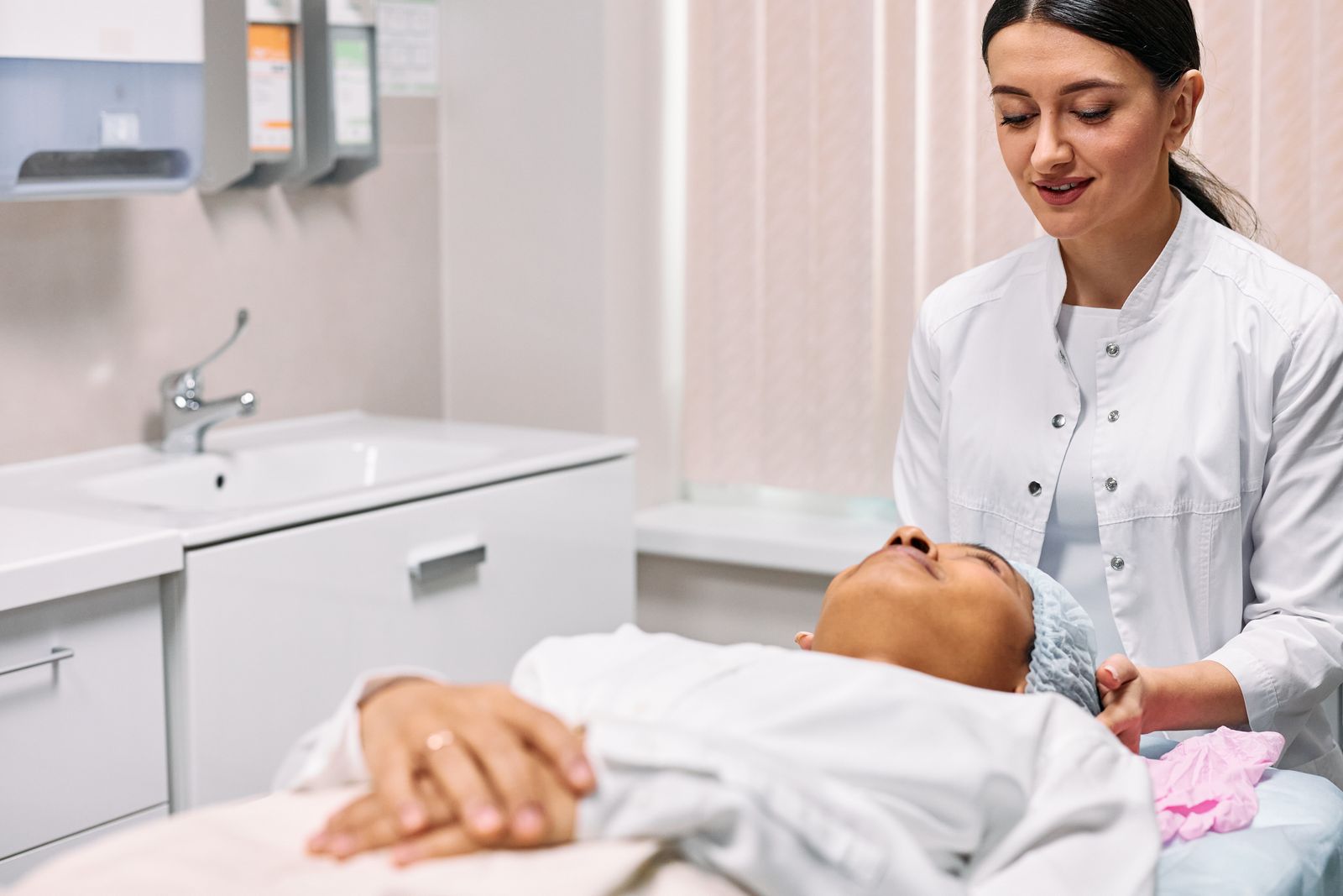 Asian woman receiving medical facial at aesthetic clinic Dubai
