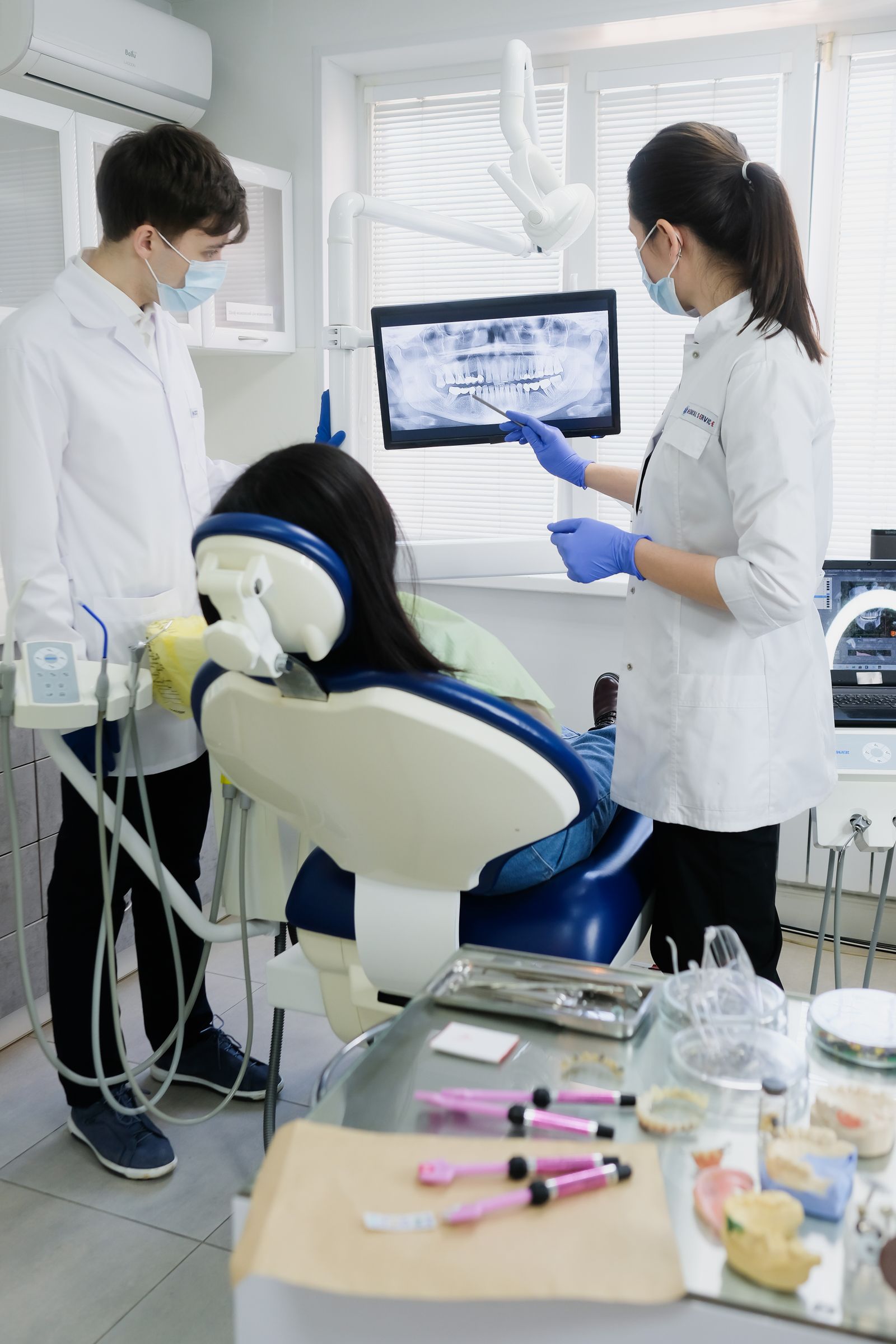 Dentists reviewing dental X-ray for restorative treatment