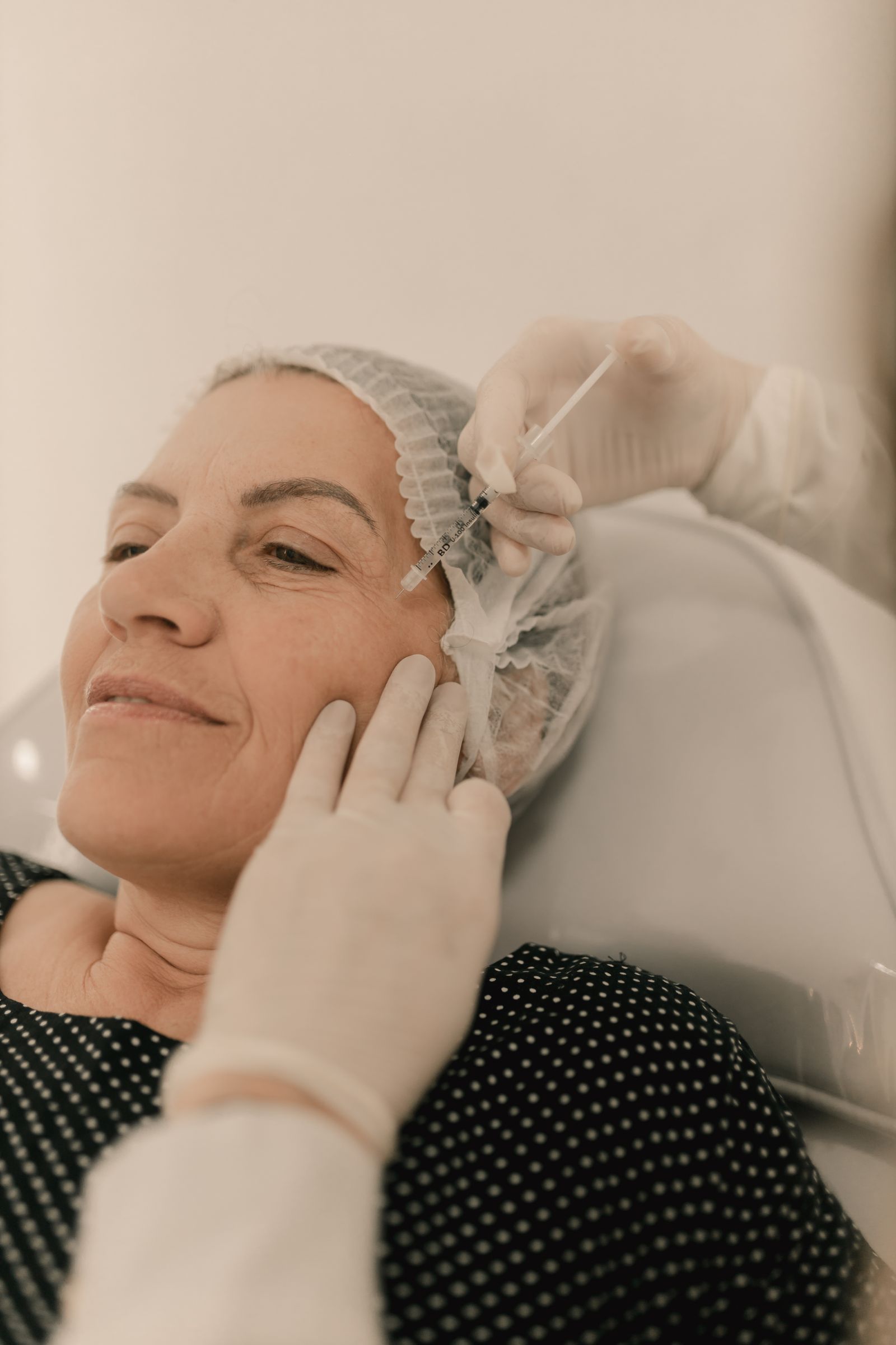 Middle-aged woman receiving skin booster injection Dubai